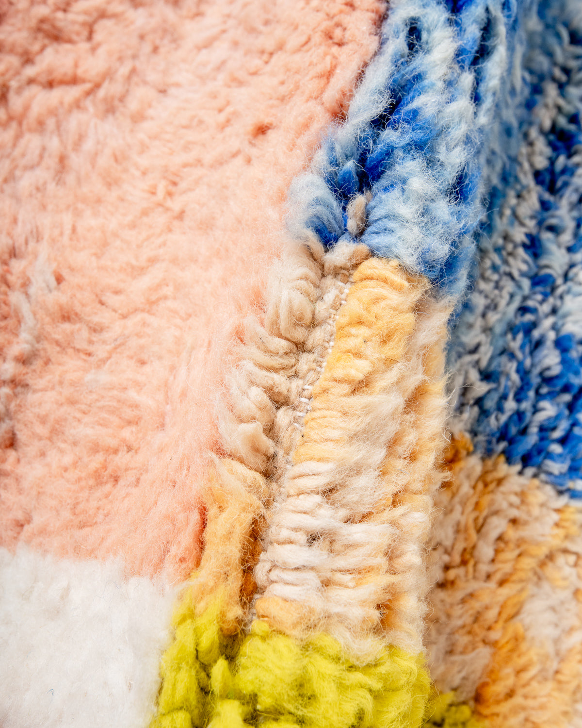 Modern, designer, handcrafted Berber rug from Morocco. Beniourain carpet with beautiful colours and patterns and fluffy wool texture.
